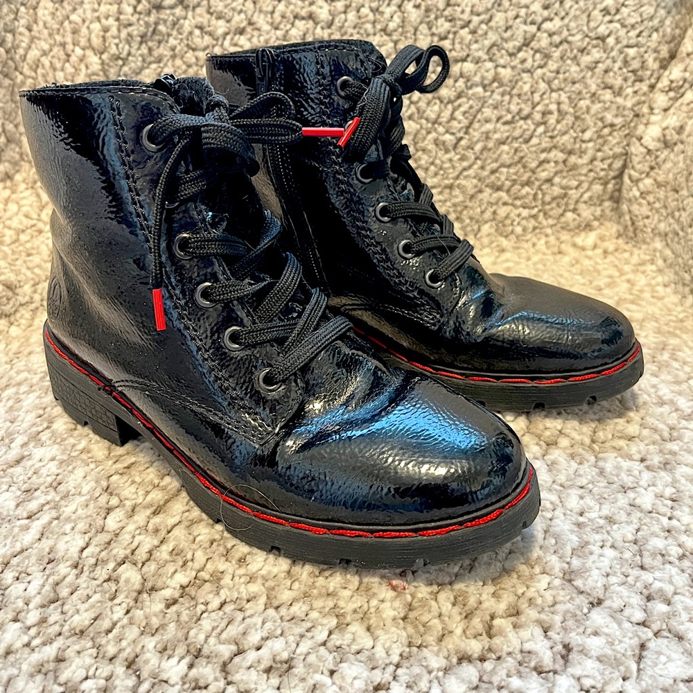 Rieker size 8 (39). Black patent leather there boot with red thread.